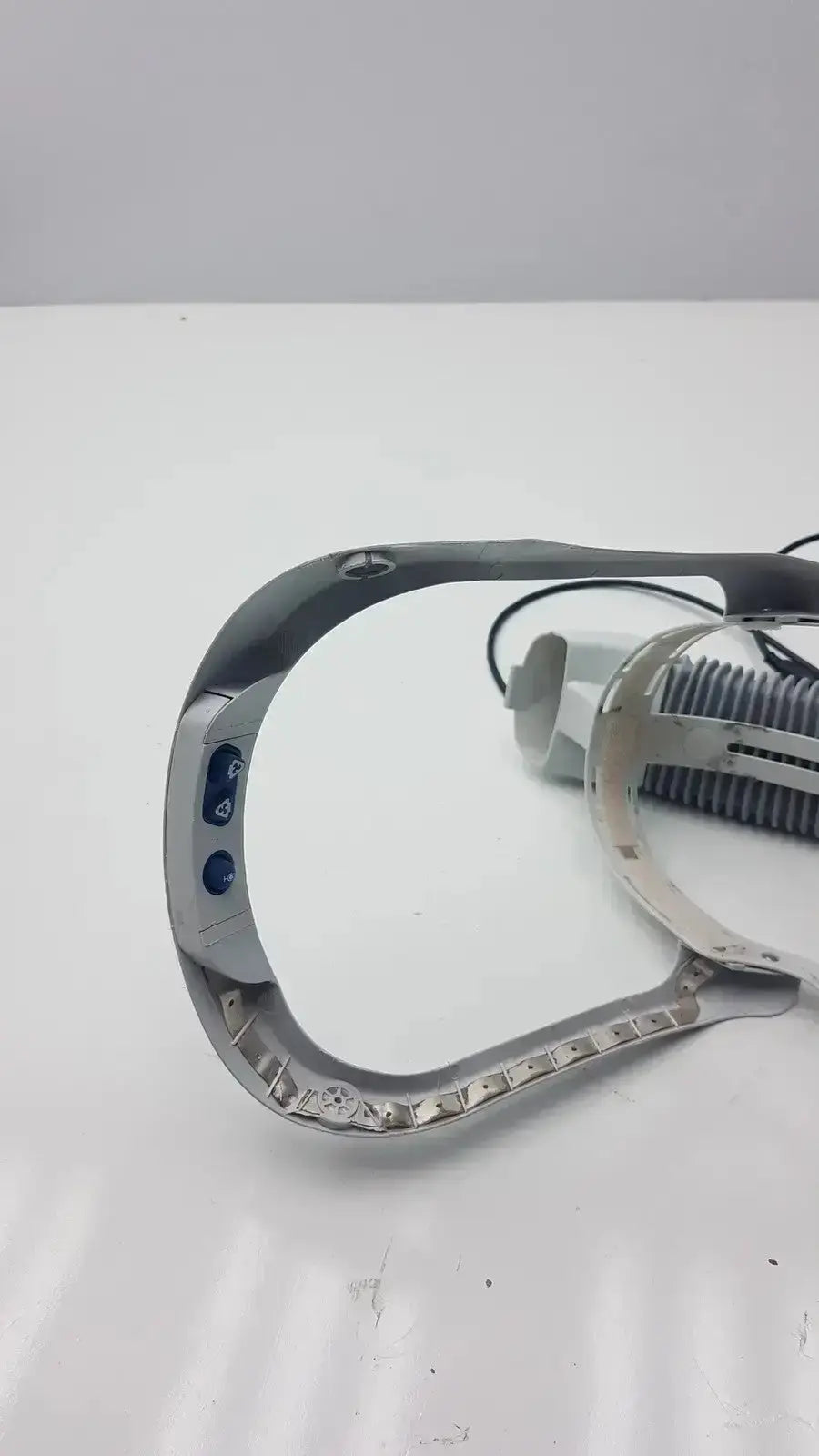 Silver metallic frame of stryker flyte helmet ref 0408-600-000 with blue buttons and textured grip