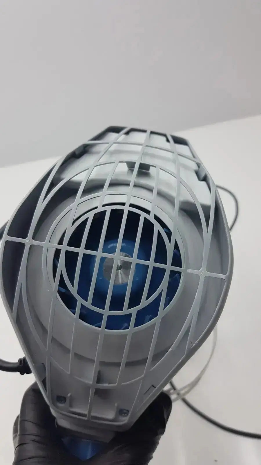 Gray plastic fan with blue motor and protective wire grid in stryker flyte helmet ref 0408-600-000 accessory