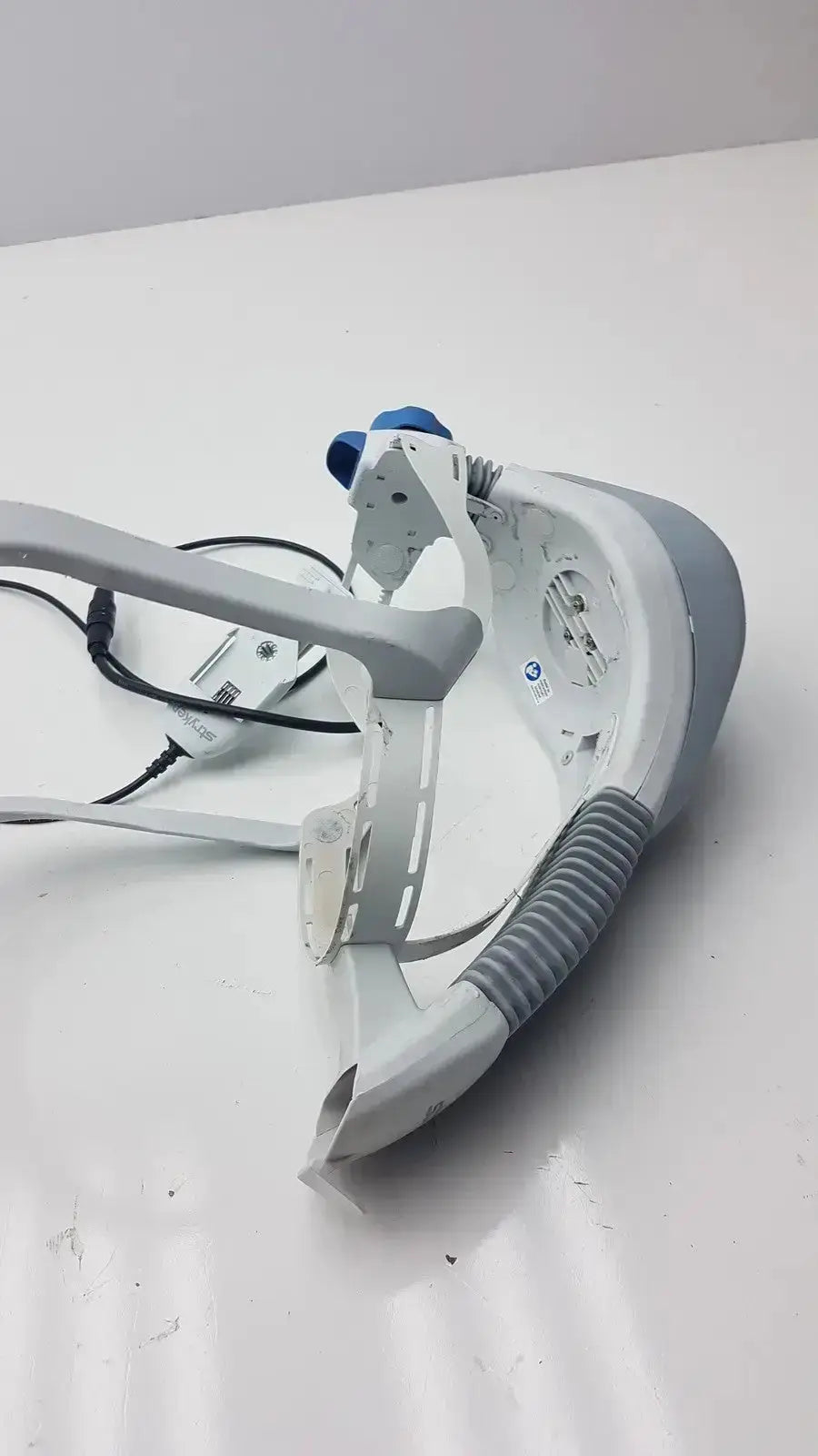 White and gray stryker flyte helmet ref plastic vr headset with blue accents featuring a sleek design