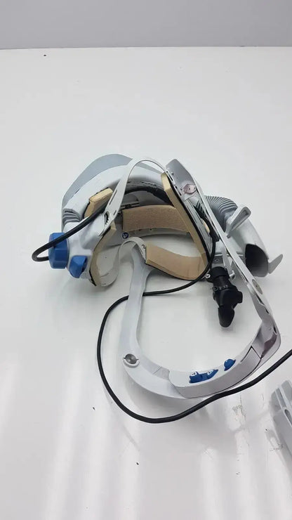 White and blue stryker flyte helmet with adjustable straps and articulated arms for surgical use