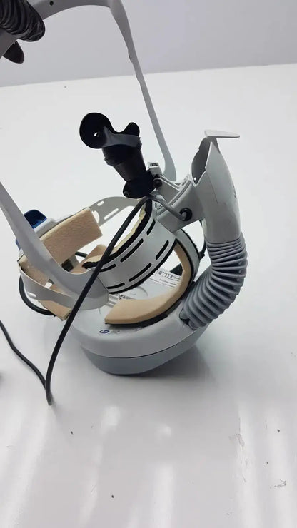 Gray and black stryker flyte helmet with adjustable straps, flexible tube, and camera mount for medical use