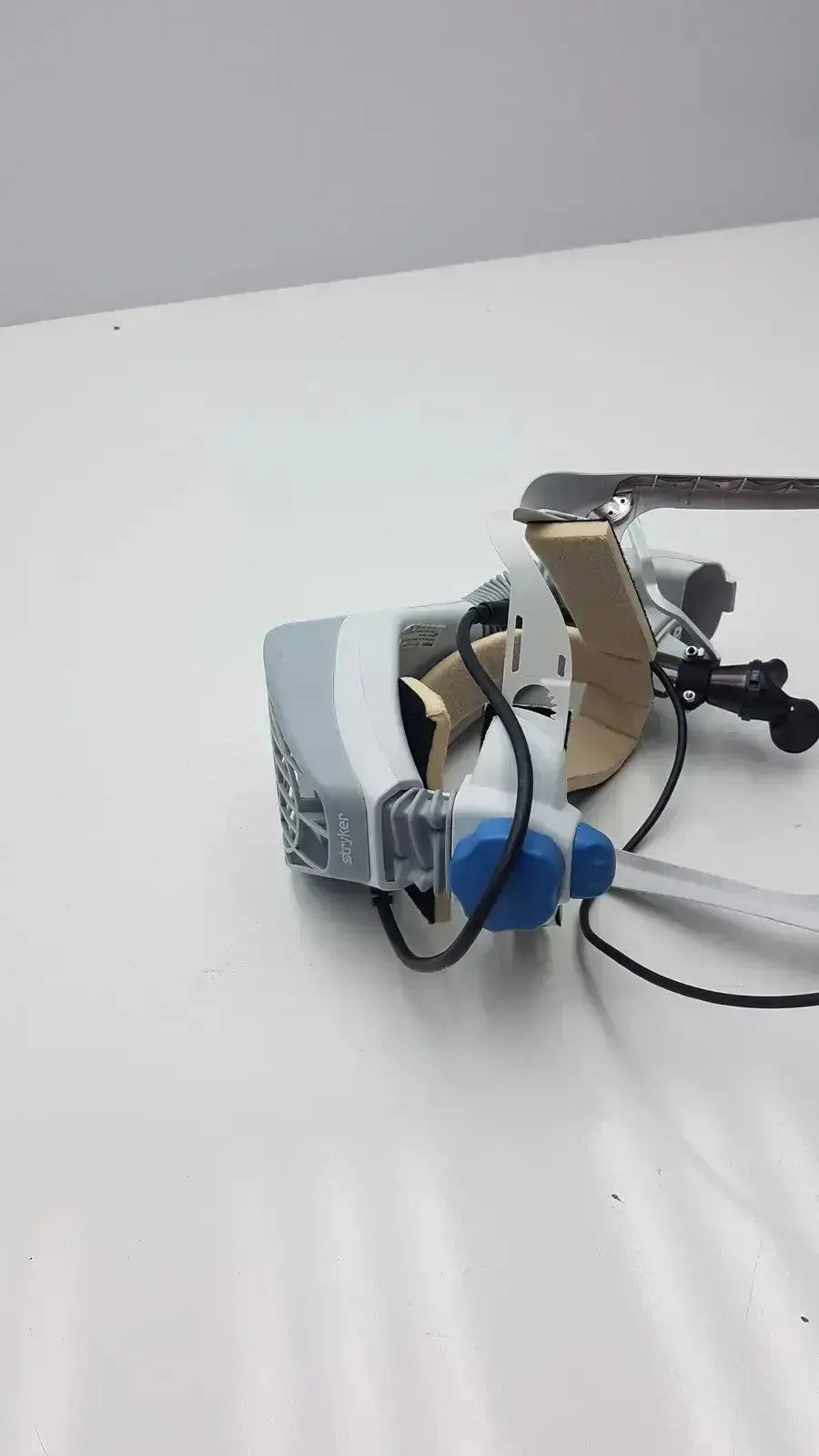 Gray and blue Stryker Flyte helmet with adjustable head strap designed for secure VR headset wear