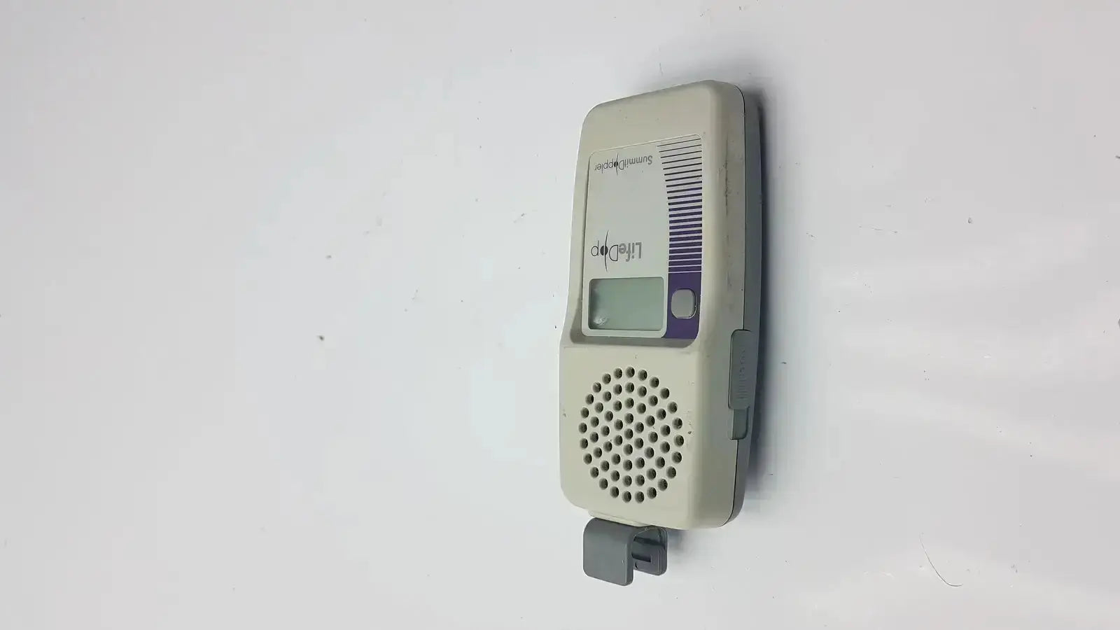 Beige and gray lifedop l250ar handheld doppler with small digital screen speaker grille and 2 mhz probe