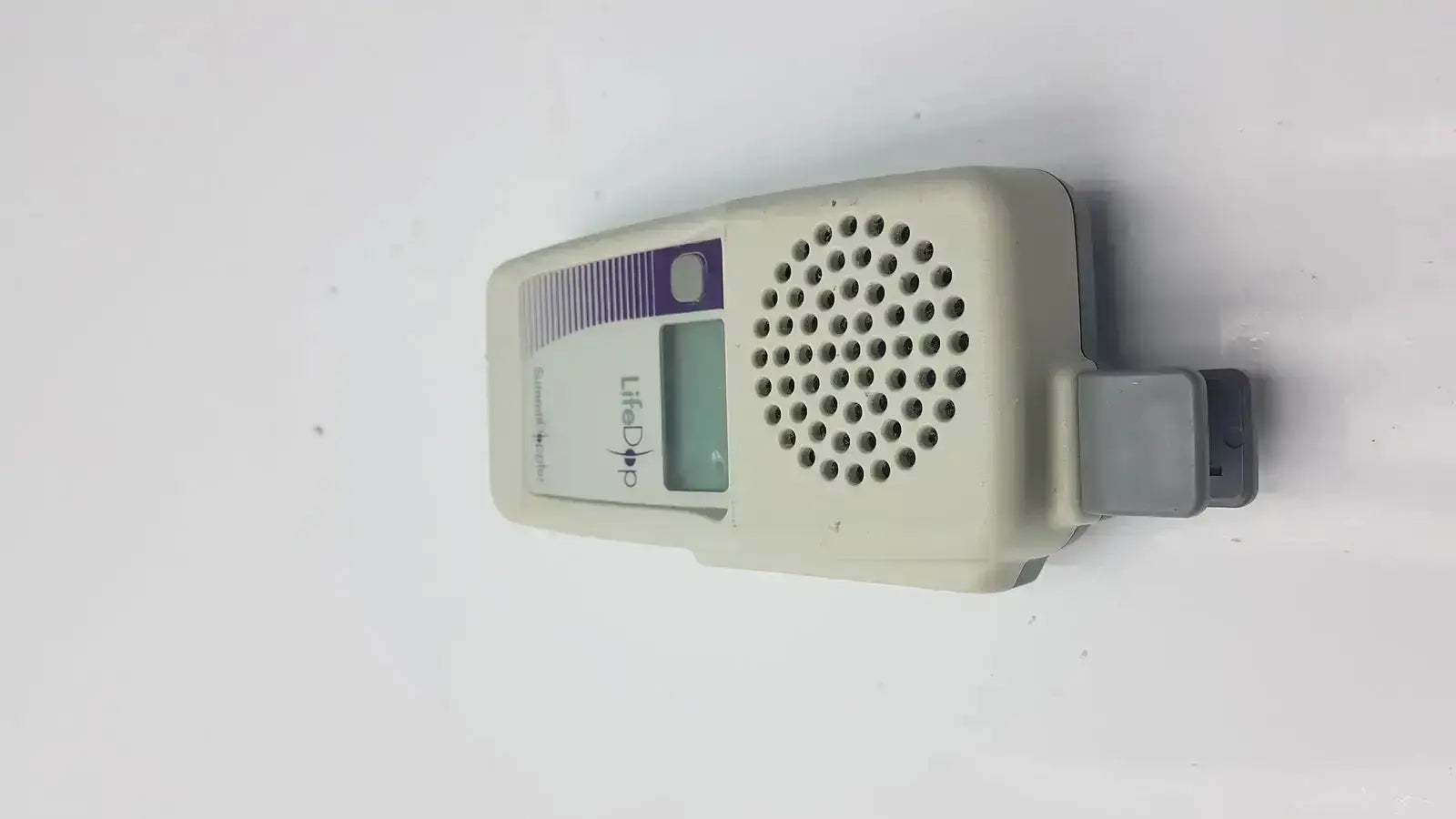 Beige plastic summiit doppler lifedop l250ar handheld with small digital display perforated speaker grille and 2 mhz probe
