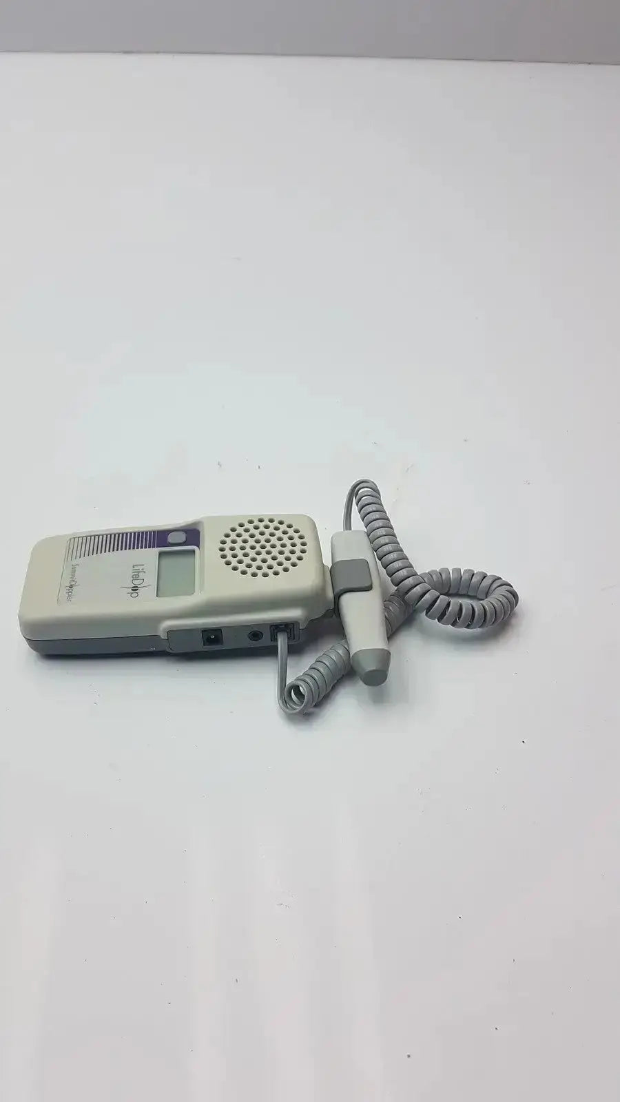 Gray and white handheld lifeDop l250ar fetal heart rate monitor with 2 MHz probe and coiled cord for prenatal use