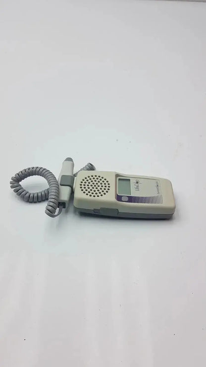 Beige and gray handheld lifedop l250ar fetal heart rate monitor with 2 mhz probe and coiled cord