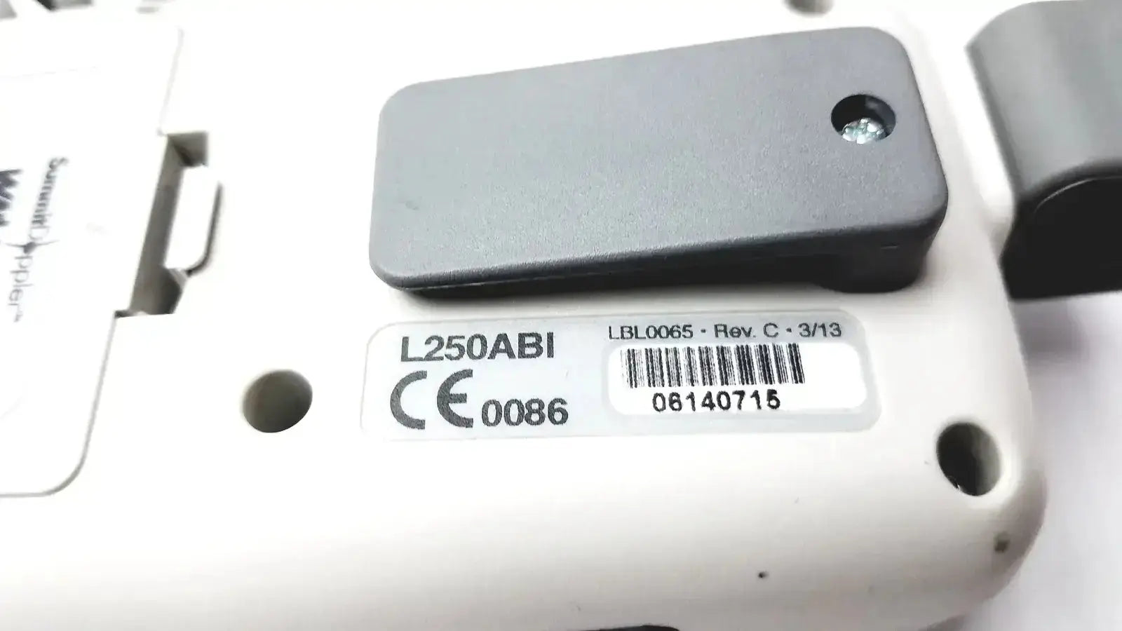 Gray rectangular sensor module with circular hole and metallic accent mounted on white plastic housing for summiit liifedop abi l250