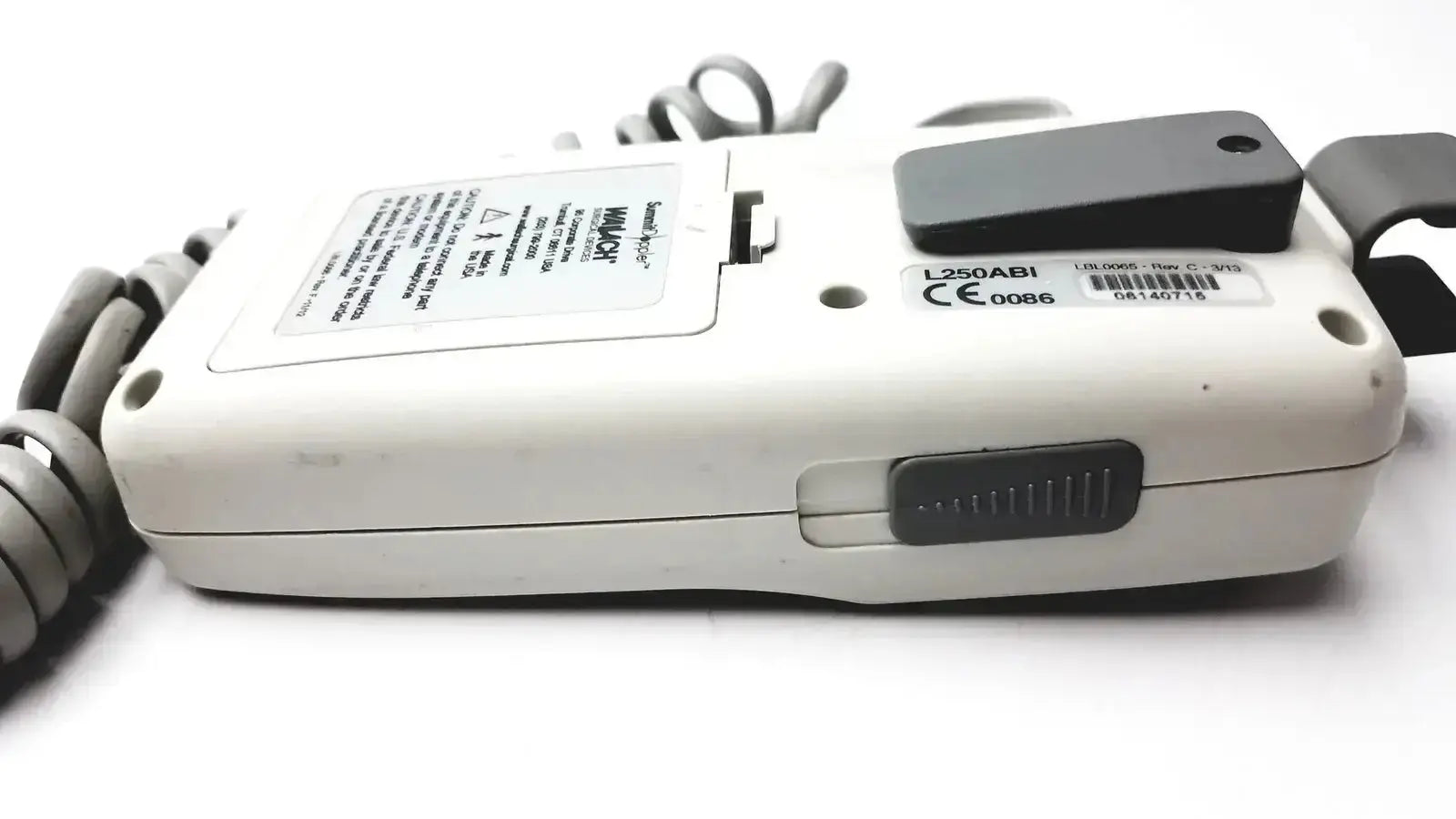 White plastic handheld device with black accents and coiled gray cable for summiit liifedop abi l250 vascular system