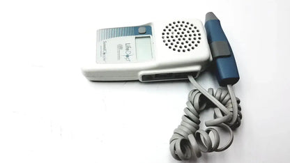 White and blue handheld fetal doppler with coiled gray cord from summiit liifedop abi l250 vascular system model abi l250