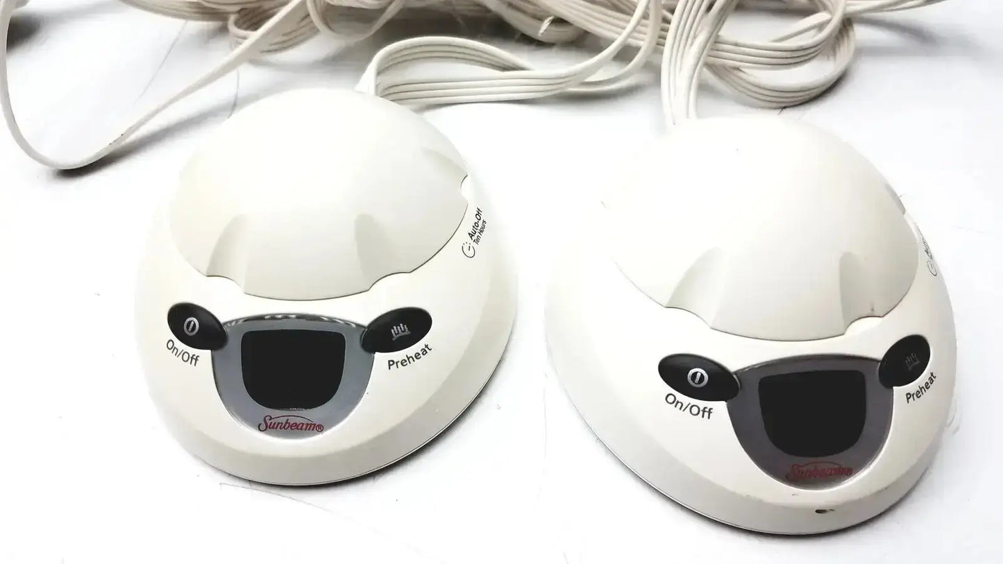 Two white sunbeam foot warmers with black control buttons and digital display for l78-dd2d style 85kqp blanket controller
