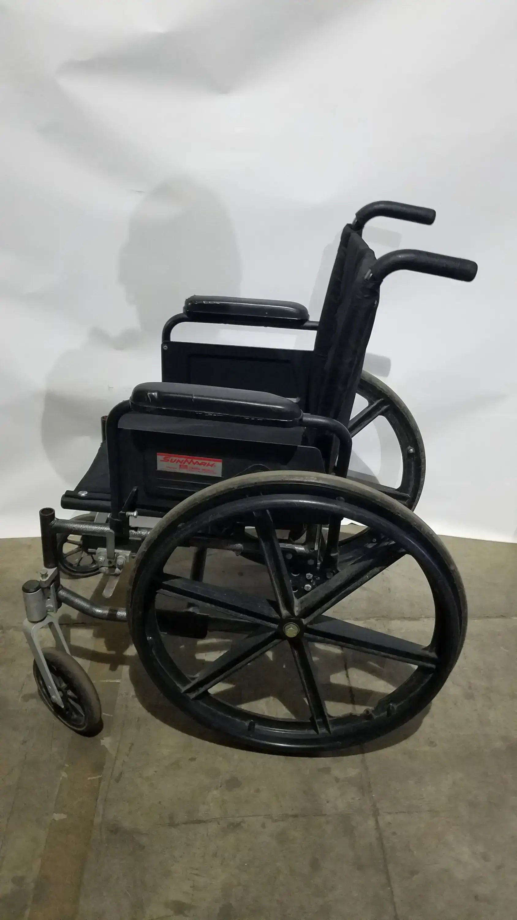 Sunmark Folding Manual Wheelchair - Durable Black Padded Comfort Seat