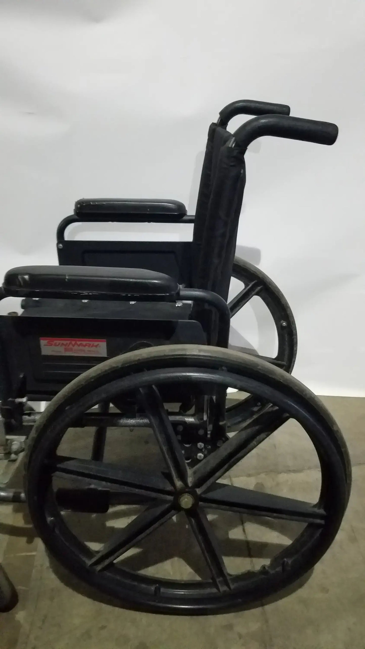 Sunmark Folding Manual Wheelchair - Durable Black Padded Comfort Seat
