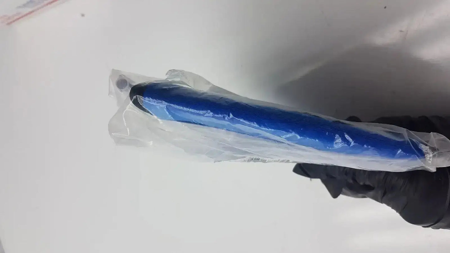 Blue suntech abpm cuff adult plus cylindrical cuff wrapped in clear plastic held by a gloved hand