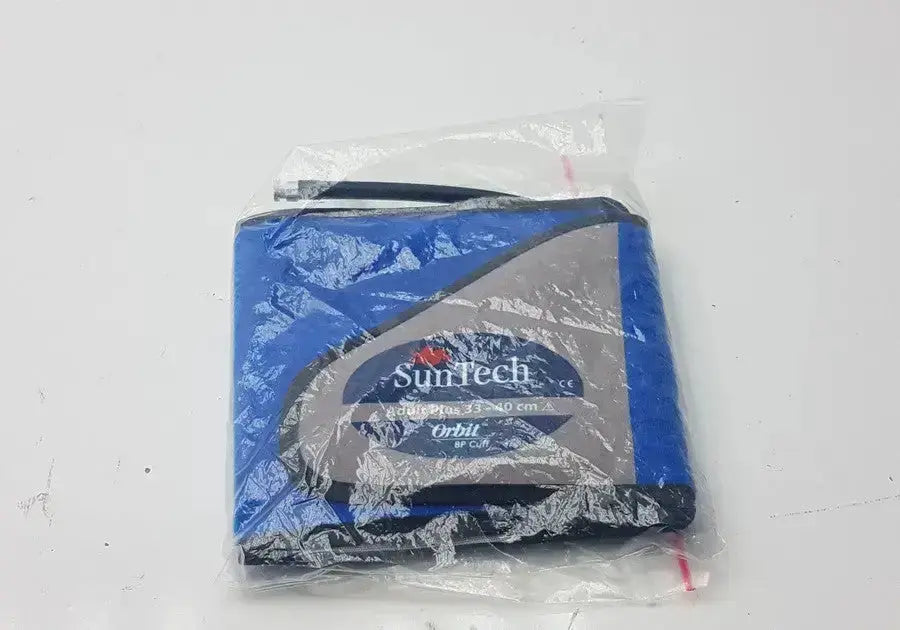 Blue and gray suntech abpm cuff adult plus range 33-40 cm packaged in clear plastic for ambulatory use