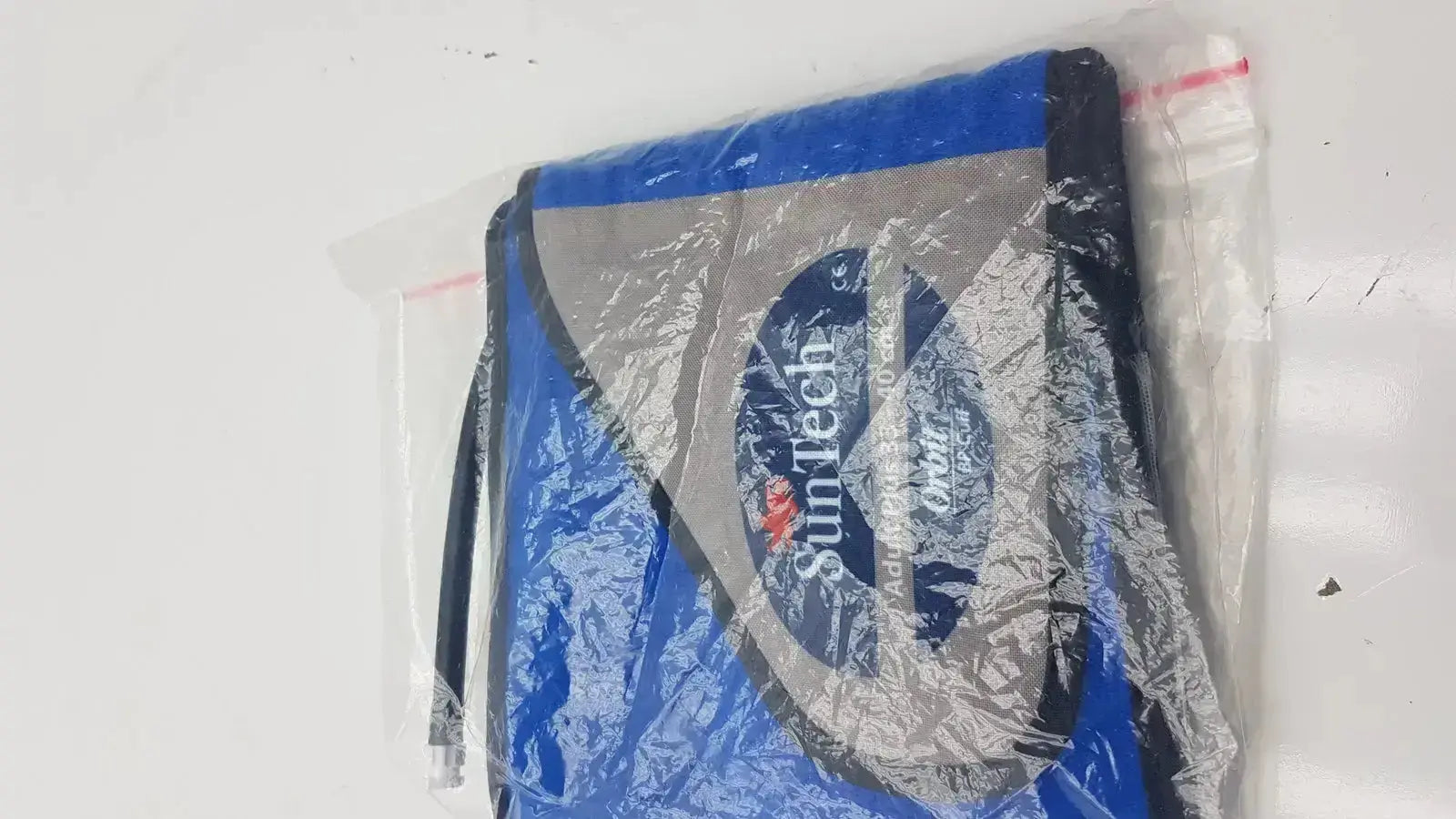 Blue and gray SunTech backpack with black trim packaged in clear plastic for SunTech ABPM cuff adult plus range 33-40 cm