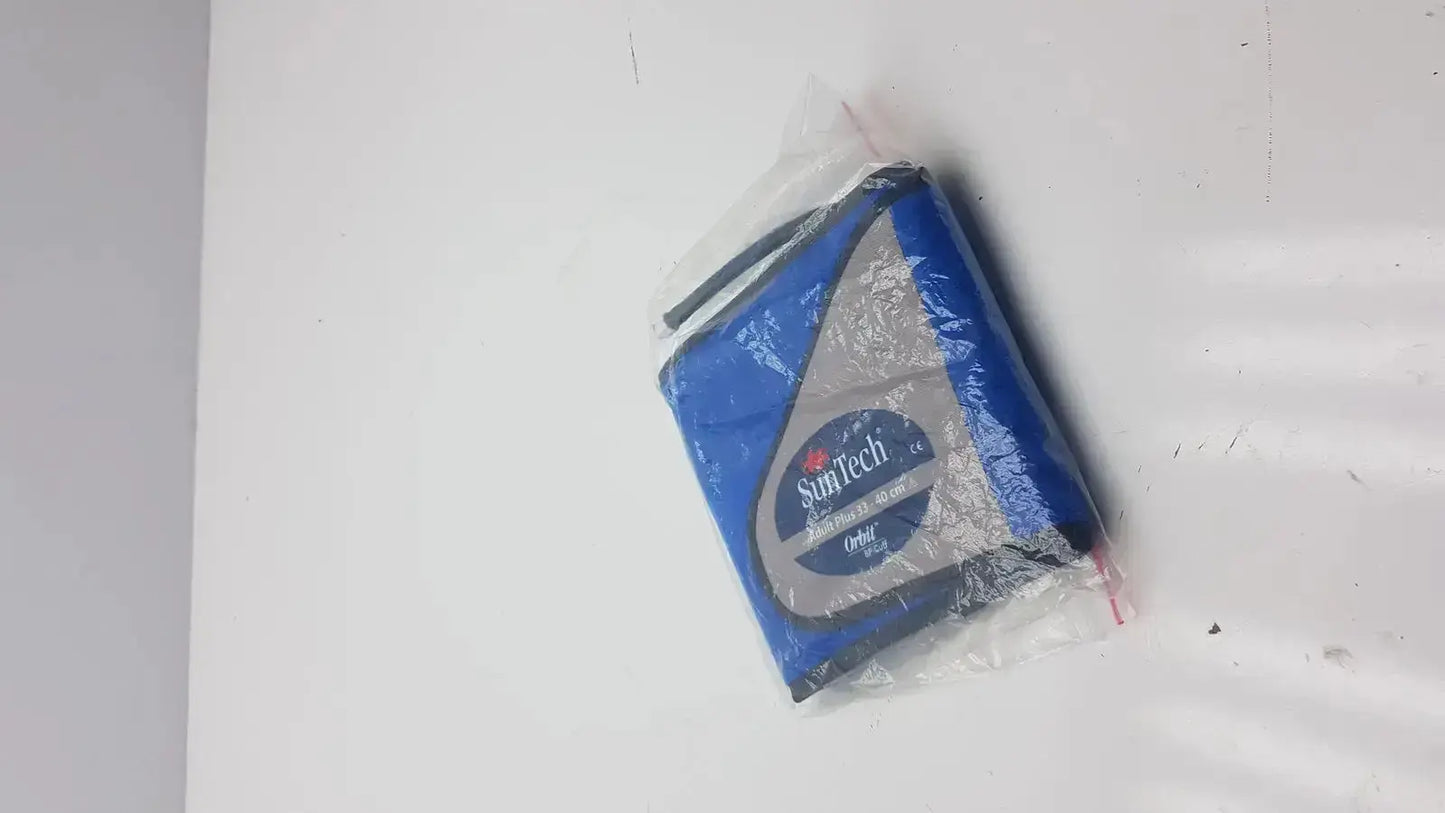 Blue and gray suntech abpm cuff adult plus range 33-40 cm tape measure wrapped in clear plastic packaging