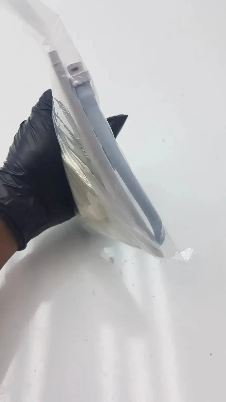 A sleek transparent plastic face shield with gray metallic frame and adjustable ear loops in suntech blood pressure kit