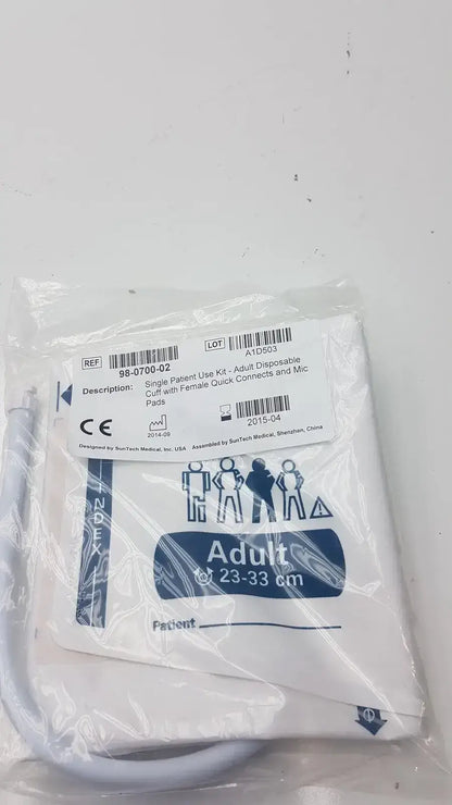 White disposable adult blood pressure cuff with blue printed labeling and measurement markings by SunTech Medical