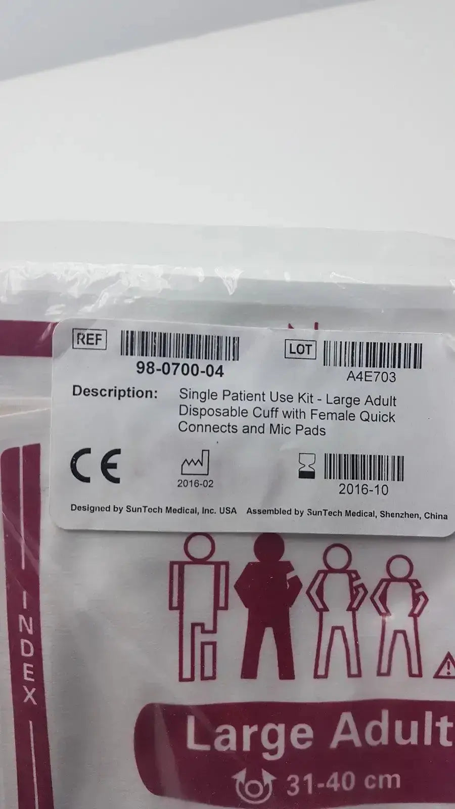 SunTech Medical single patient use kit with large adult disposable blood pressure cuff in clear plastic with red labeling