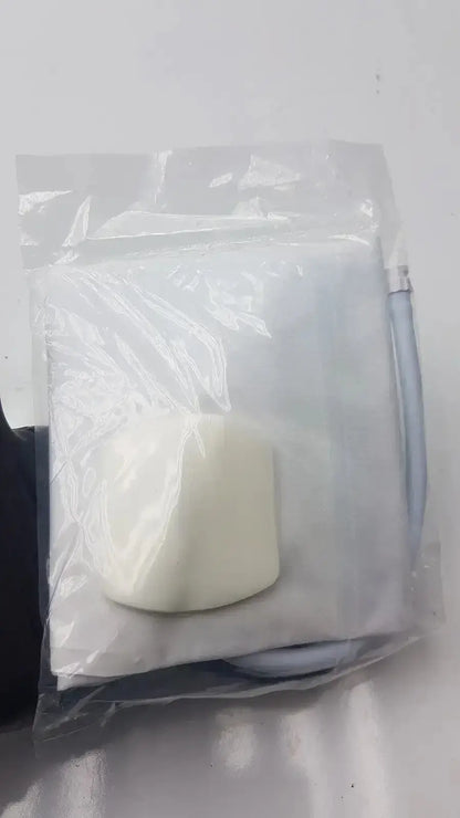 A white soft-textured marshmallow inside a clear plastic bag included in suntech blood pressure disposable bp cuff kit