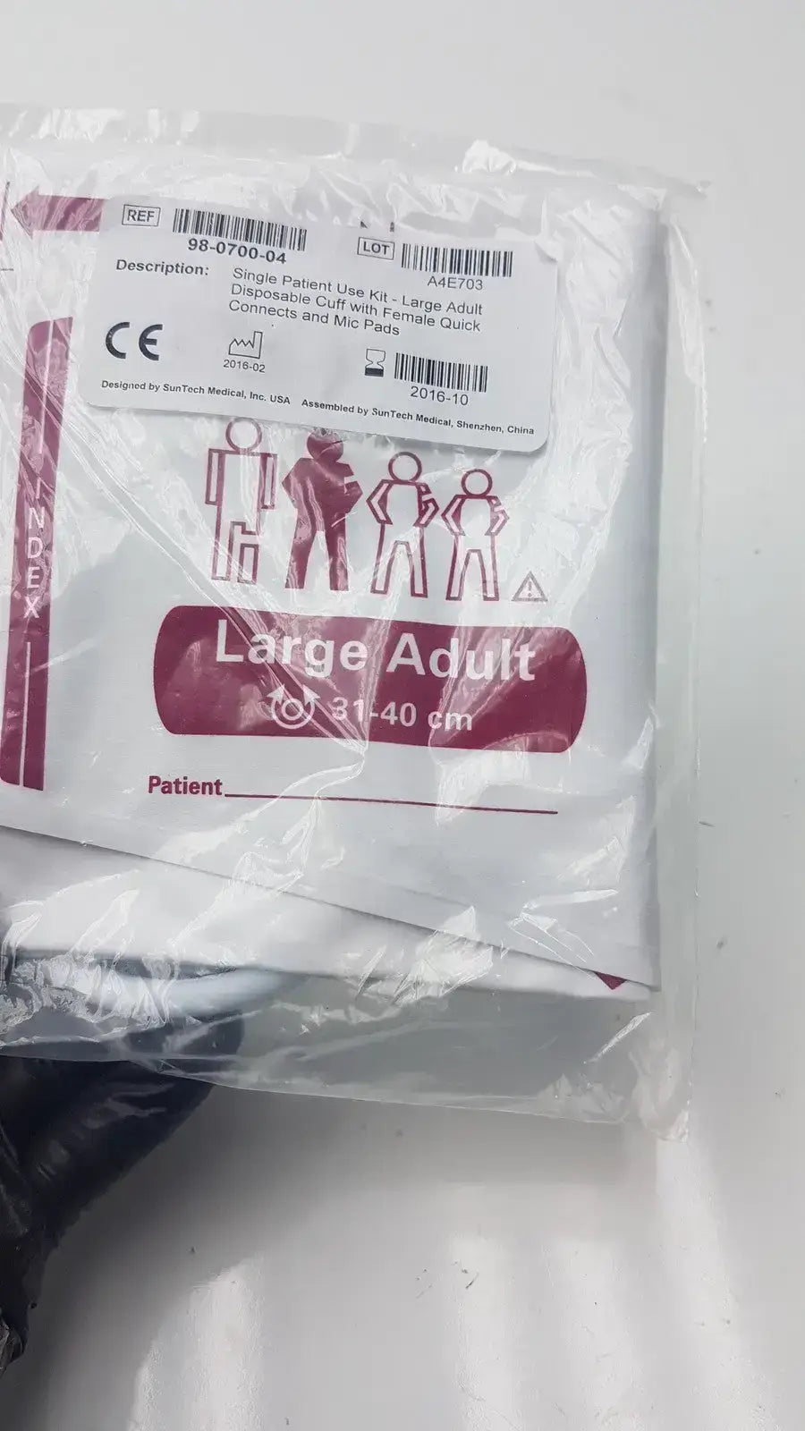 White plastic-wrapped suntech medical disposable blood pressure cuff kit for large adults with maroon and black text