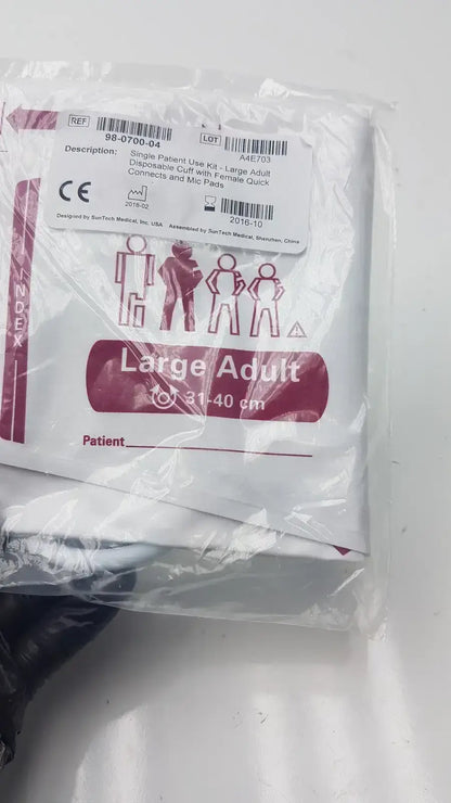 White plastic-wrapped suntech medical disposable blood pressure cuff kit for large adults with maroon and black text