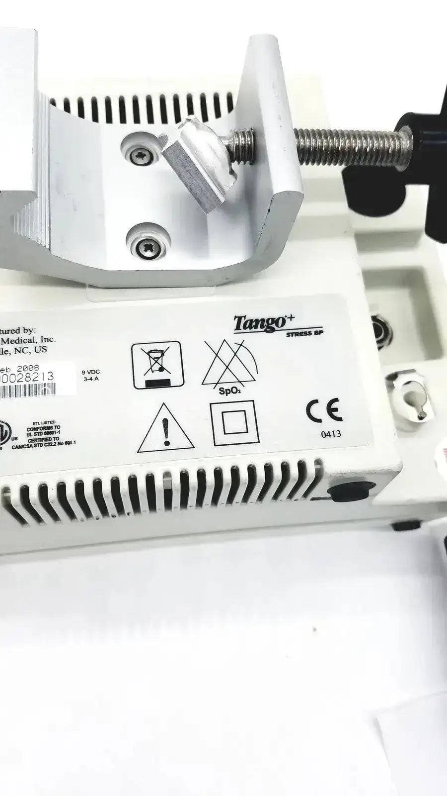 White suntech medical tango bp monitor with metallic clamp and screw mechanism for precise blood pressure measurement