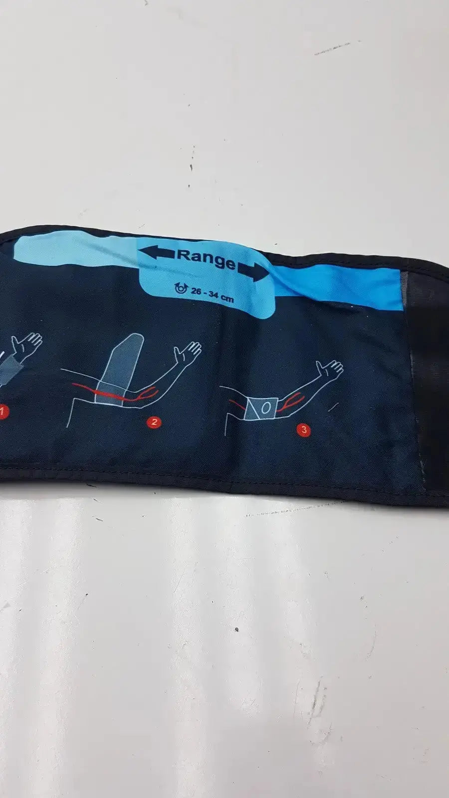Dark blue fabric suntech orbit abpm cuff size 2 with light blue adjustment strap and sizing instructional diagrams
