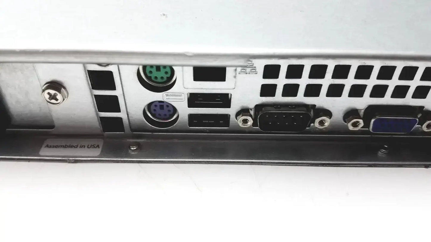 Back side of silver metal supermicro 5015b-mt super server rack with green and purple circular ports usb and vga connectors
