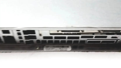 Silver-colored metal supermicro 5015b-mt super server rack showing black rectangular ports and ventilation slots on back side