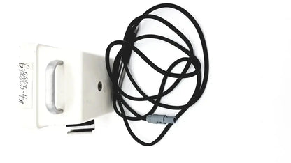 Black coiled cable with gray connector beside white sybron analytic system b dental endo heat source model 1005