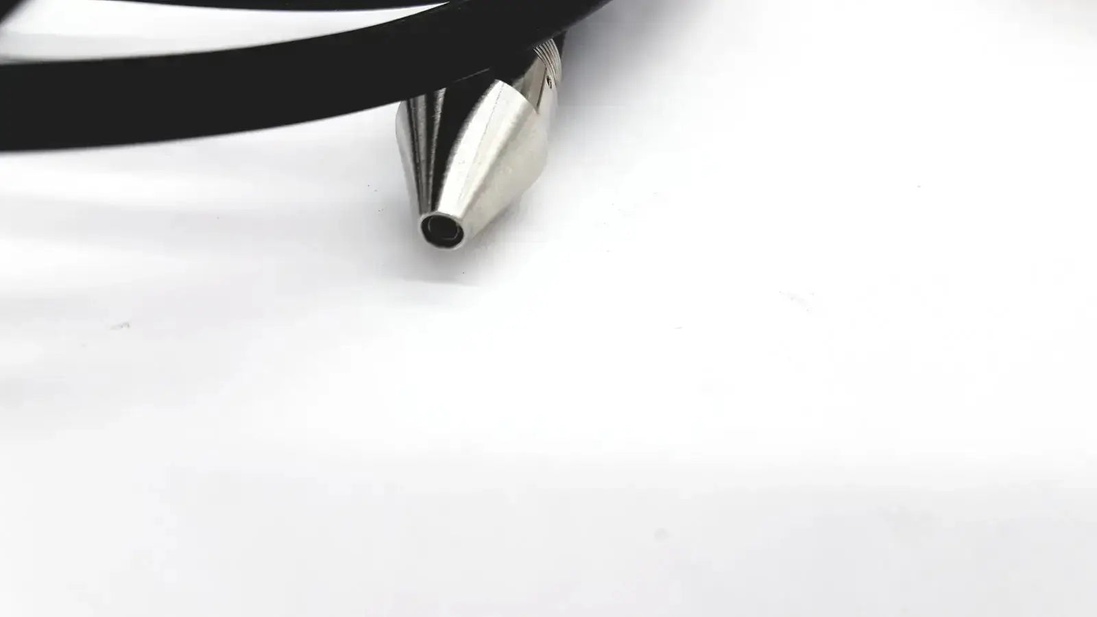 Shiny metallic cone-shaped tip of black cable for sybron analytic system b dental endo heat source model 1005