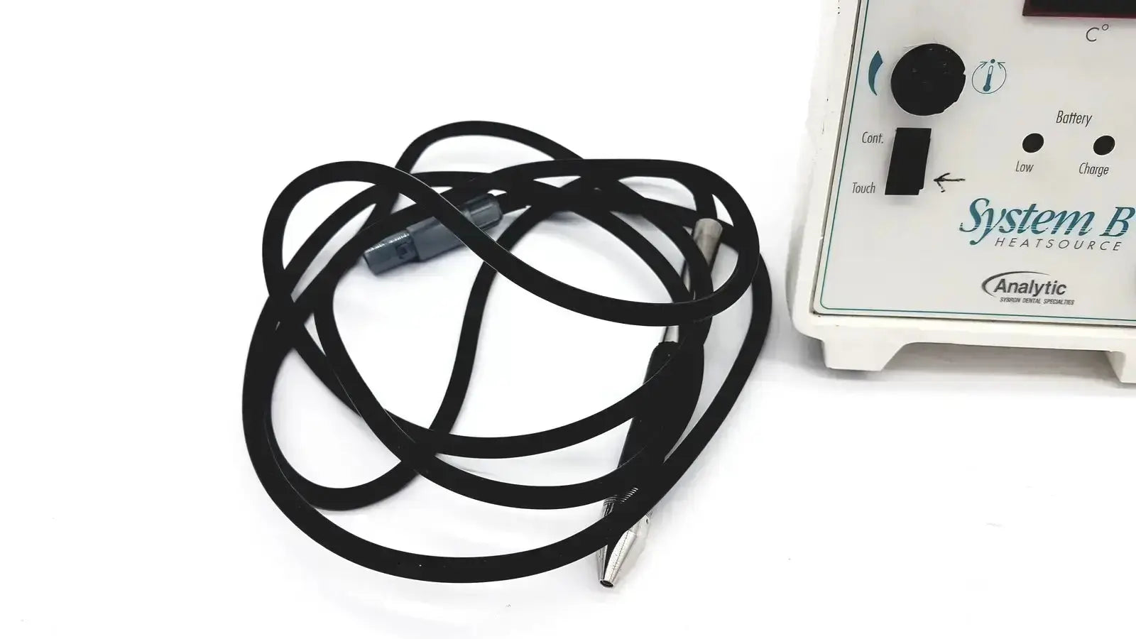 Black coiled cable with gray metallic connectors next to sybron analytic system b dental endo heat source model 1005