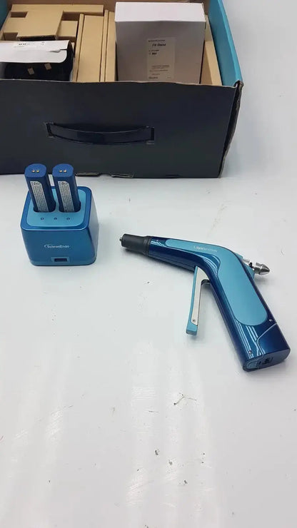 Blue handheld laser welder with ergonomic grip and metallic nozzle for sybronendo system b cordless obturation by kerr endodontic