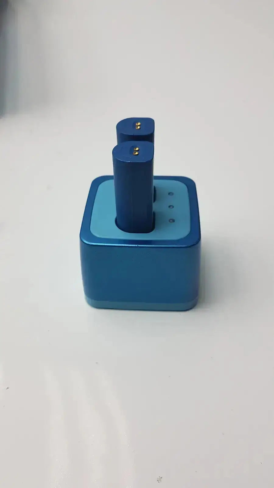 Blue square-shaped cordless obturation battery charger with two cylindrical batteries for sybronendo system b g-cir-r4-30f used medical equipment for sale