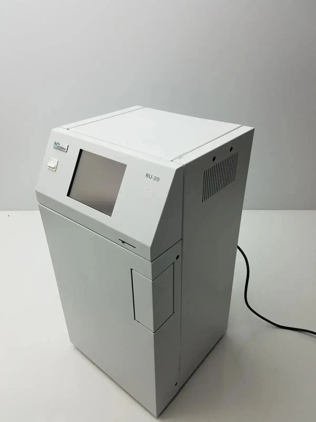 White rectangular Sysmex RU-20 reagent delivery system with small screen for precise reagent delivery in laboratories