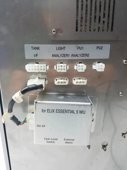 Silver metallic reagent delivery box labeled for elix essential 5 wu with white connectors and black cable for sysmex ru-20 reagent delivery system