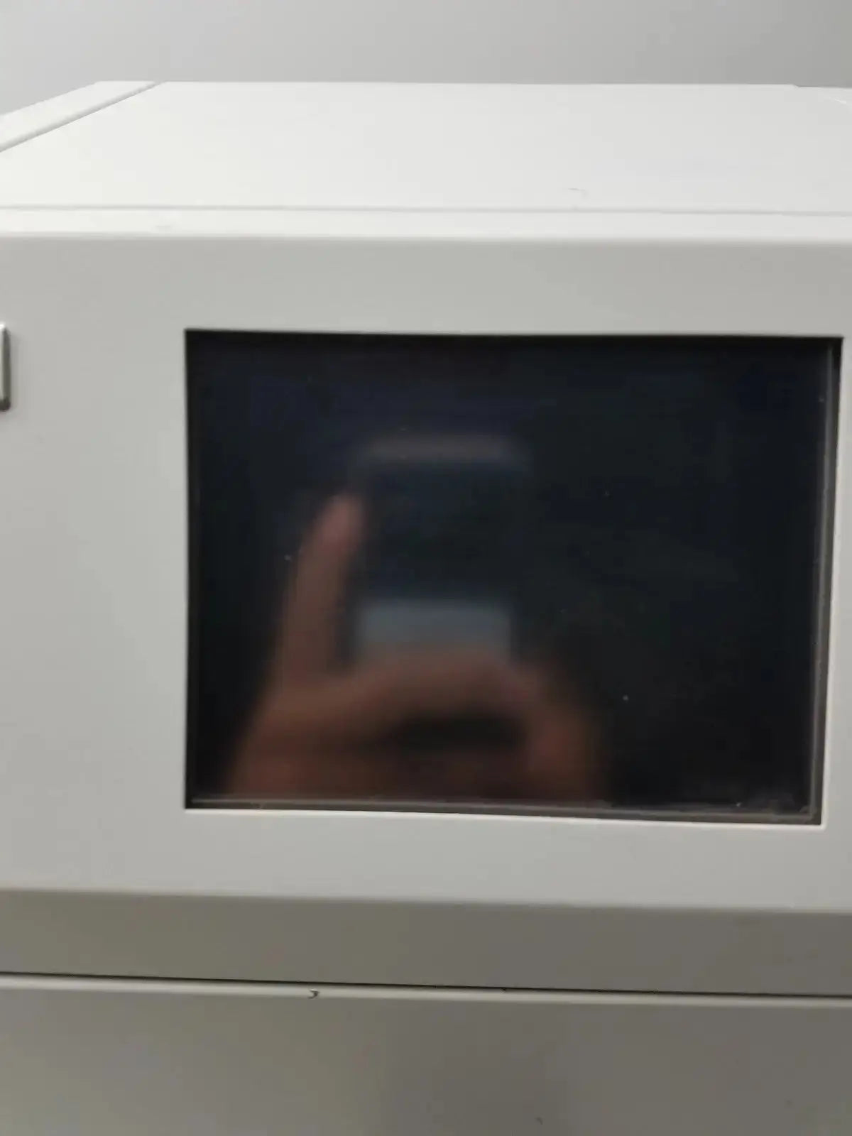 White microwave with rectangular glass door and digital display for sysmex ru-20 reagent delivery system laboratory use