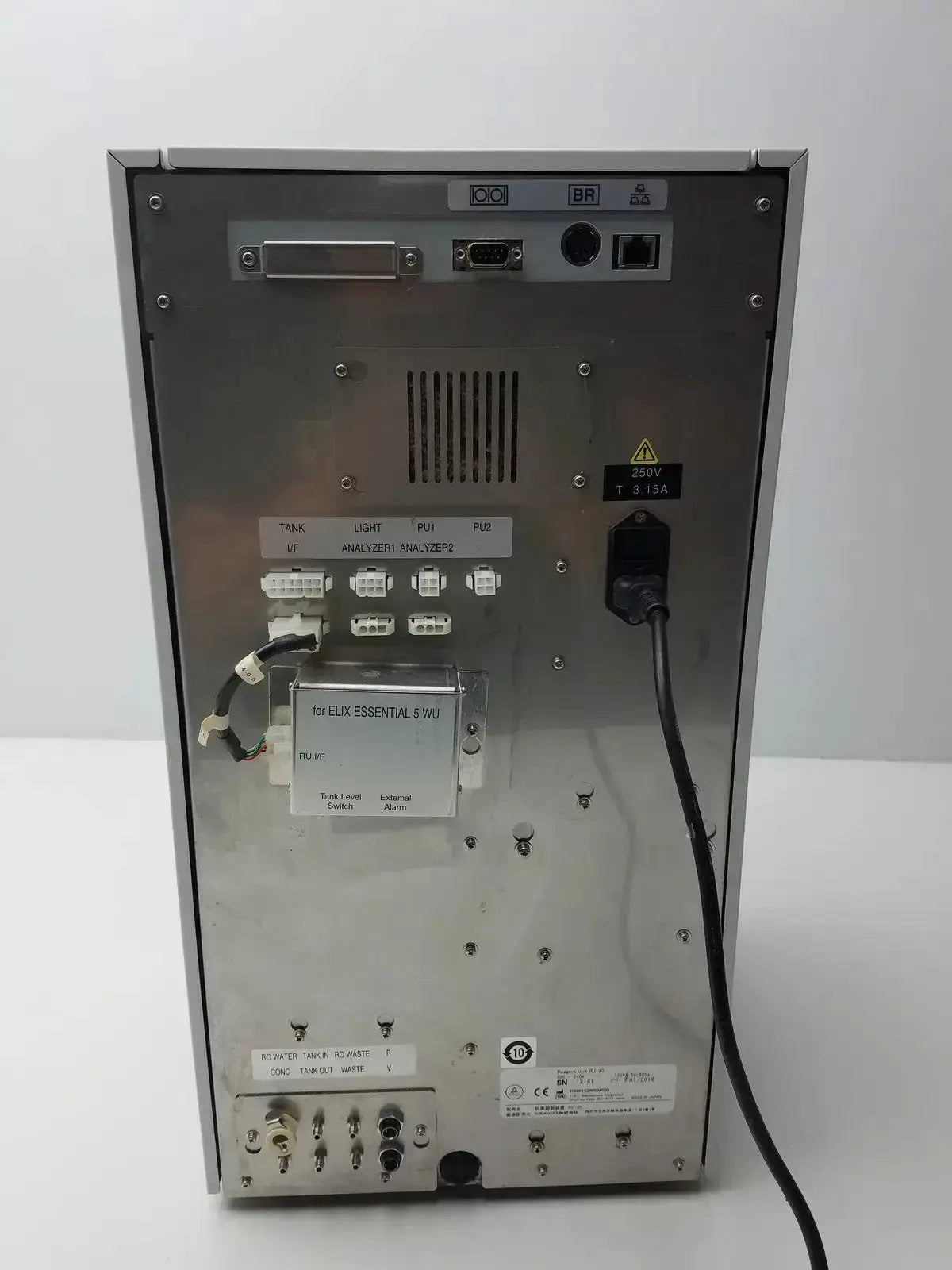 Silver metallic back panel of sysmex ru-20 reagent delivery system featuring multiple ports and connectors for reagent delivery