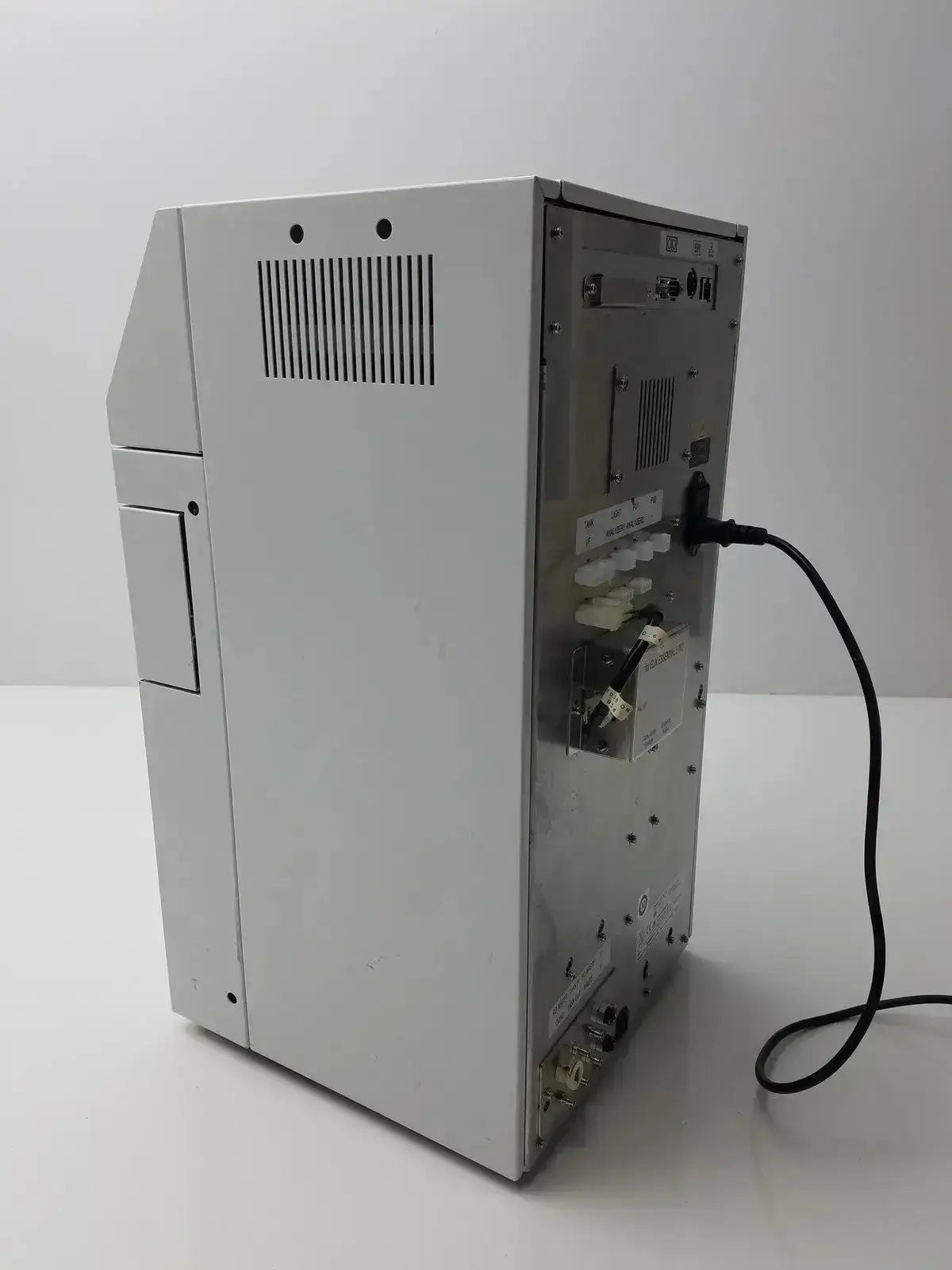 Back view of a silver metallic sysmex ru-20 reagent delivery system with ventilation slats and rear panel ports