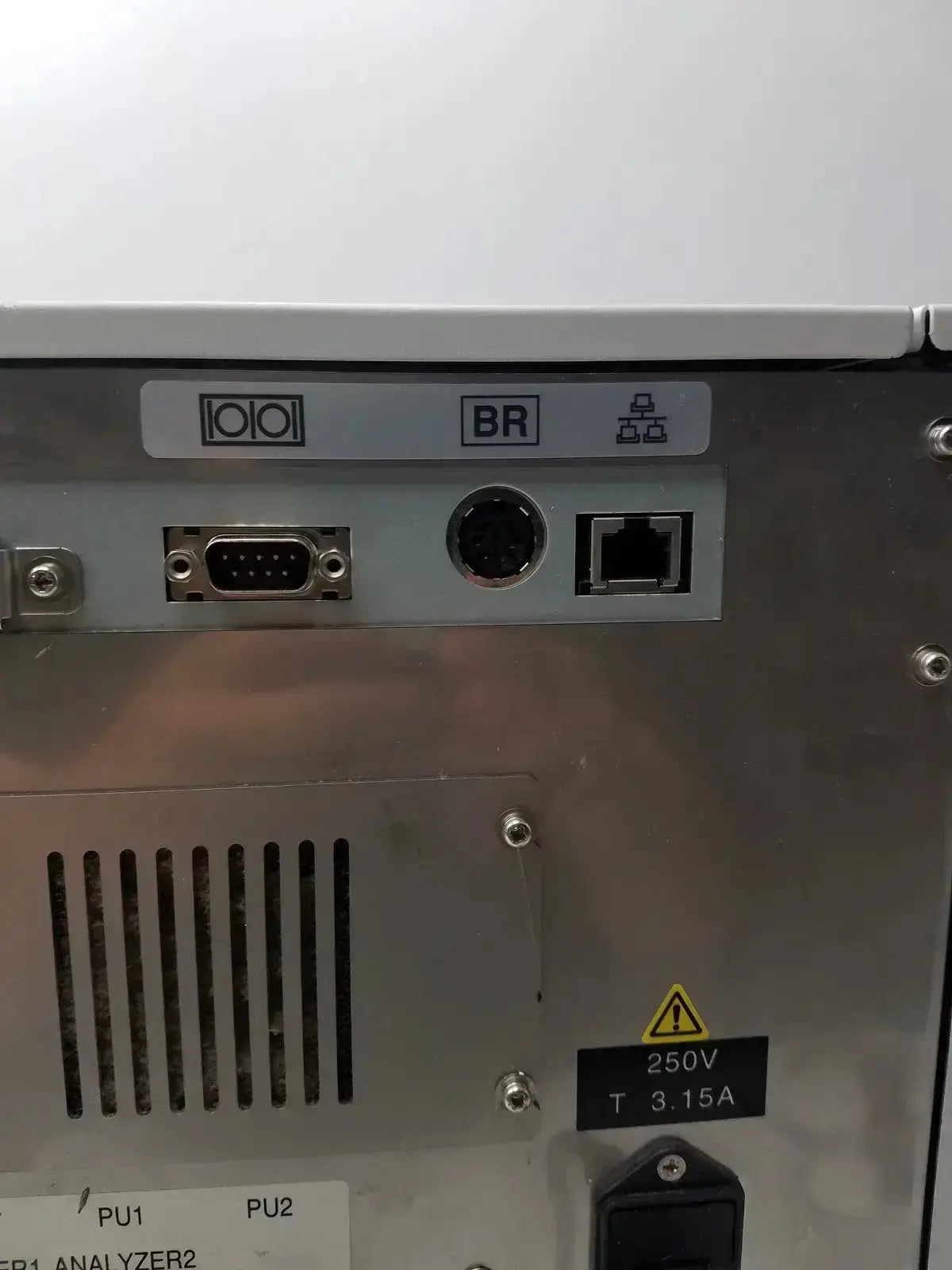 Silver metallic sysmex ru-20 reagent delivery system with labeled ports and safety warning for reagent delivery use