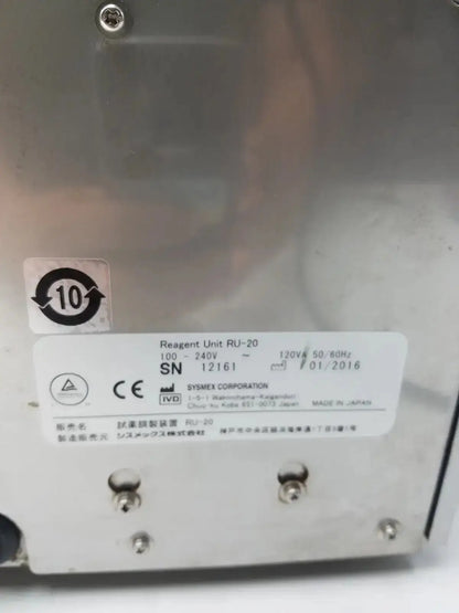 Silver metallic sysmex ru-20 reagent delivery system with white label showing technical specifications and logo