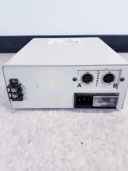 White rectangular systec ch-1448 digital tabletop dual zone temperature controller showing back with channel connectors and power input