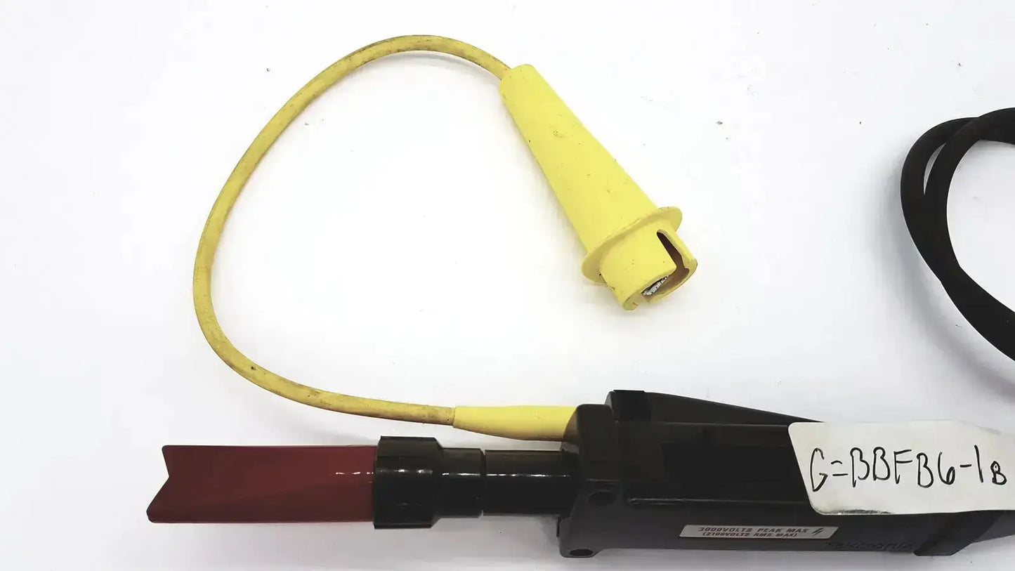 Yellow insulated probe with black handle and red tip labeled g=bbfg-18 for tektronix 3000 volts peak max use