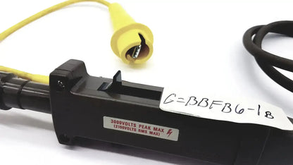 Tektronix black plastic voltage tester with yellow insulated probe and red label indicating 3000 volts peak max and 2100 volts RMS max untested