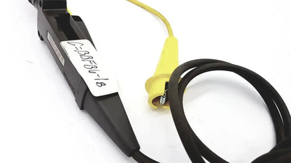 Black plastic clamp with yellow insulated probe and coiled cable for tektronix 3000 volts peak max and volts rms max tester