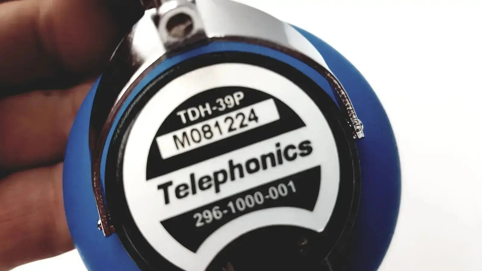 Blue telephonics tdh-39p audiometric earphones with silver metallic top and black label featuring white text