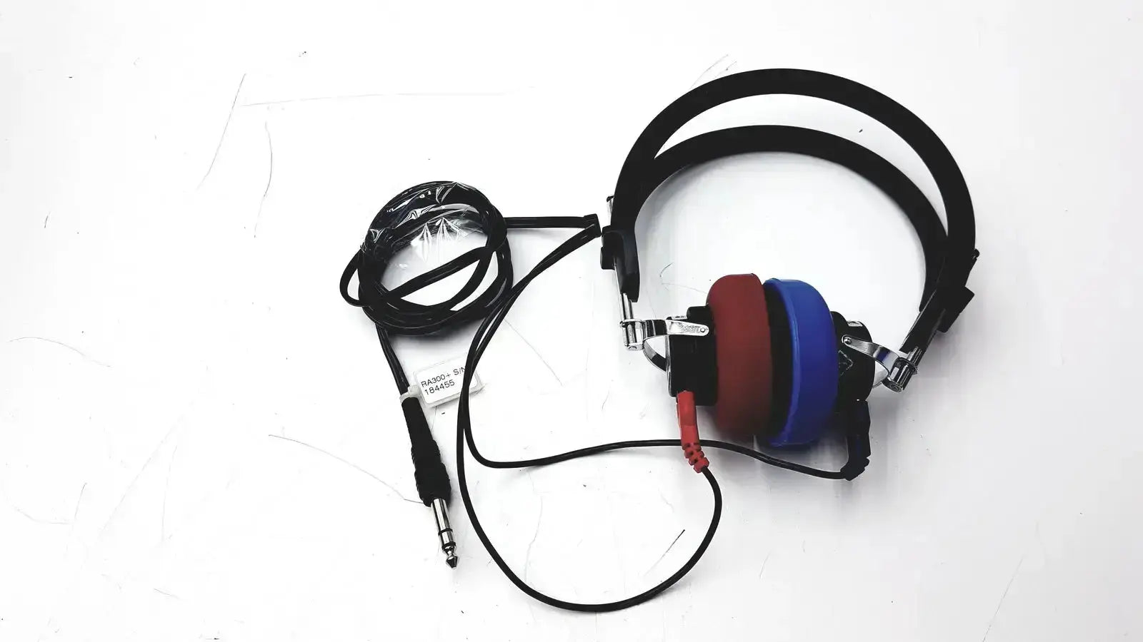 Over-ear telephonics tdh-39p audiometric earphones with black headband and bold red blue silver accents on earcups