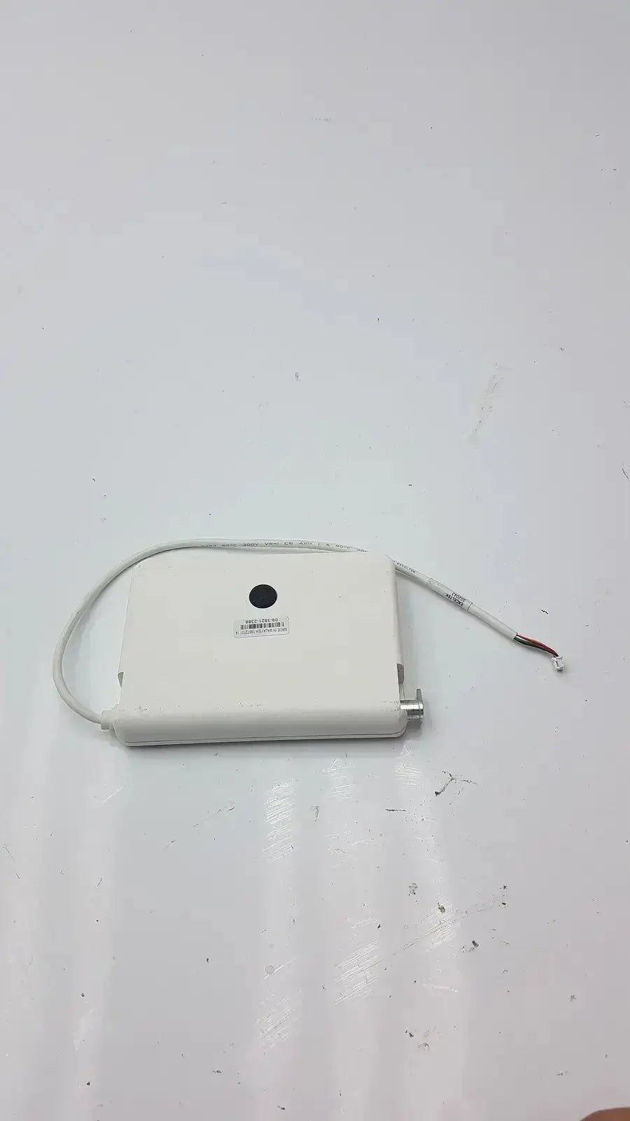 White rectangular tft hmi lcd nextion mounting frame with coiled cable and exposed wire ends visible on the back side
