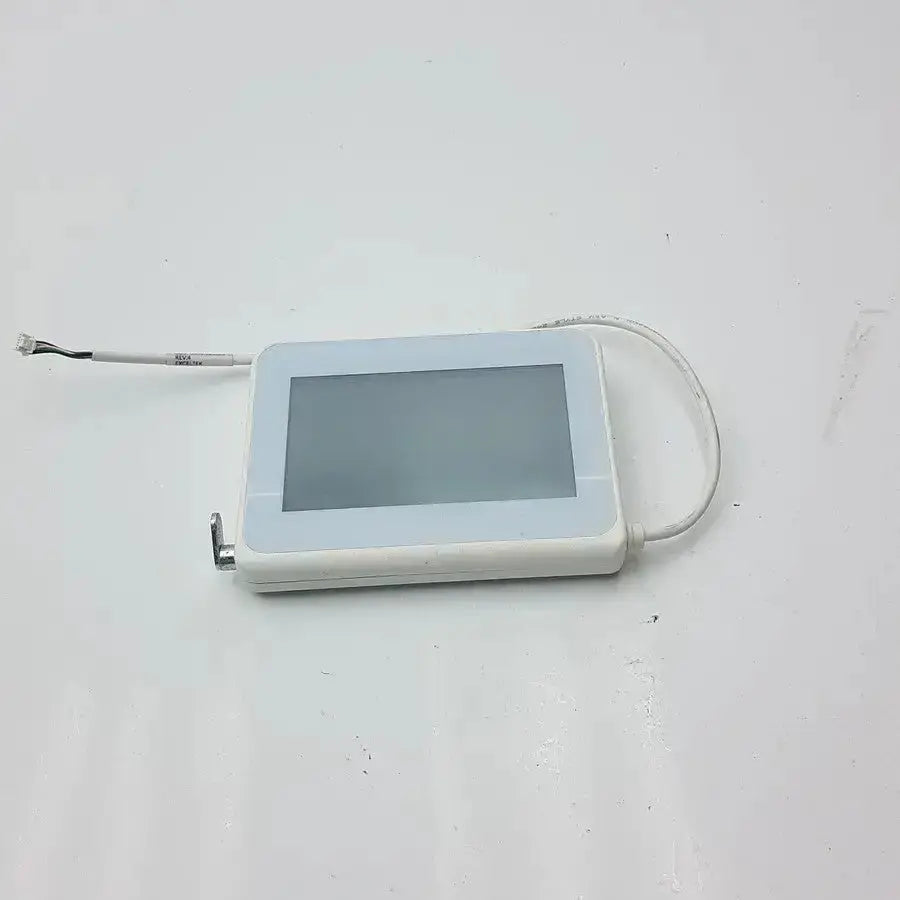 White rectangular tft hmi lcd nextion touchscreen display with matte finish connected by thin cables in mounting frame